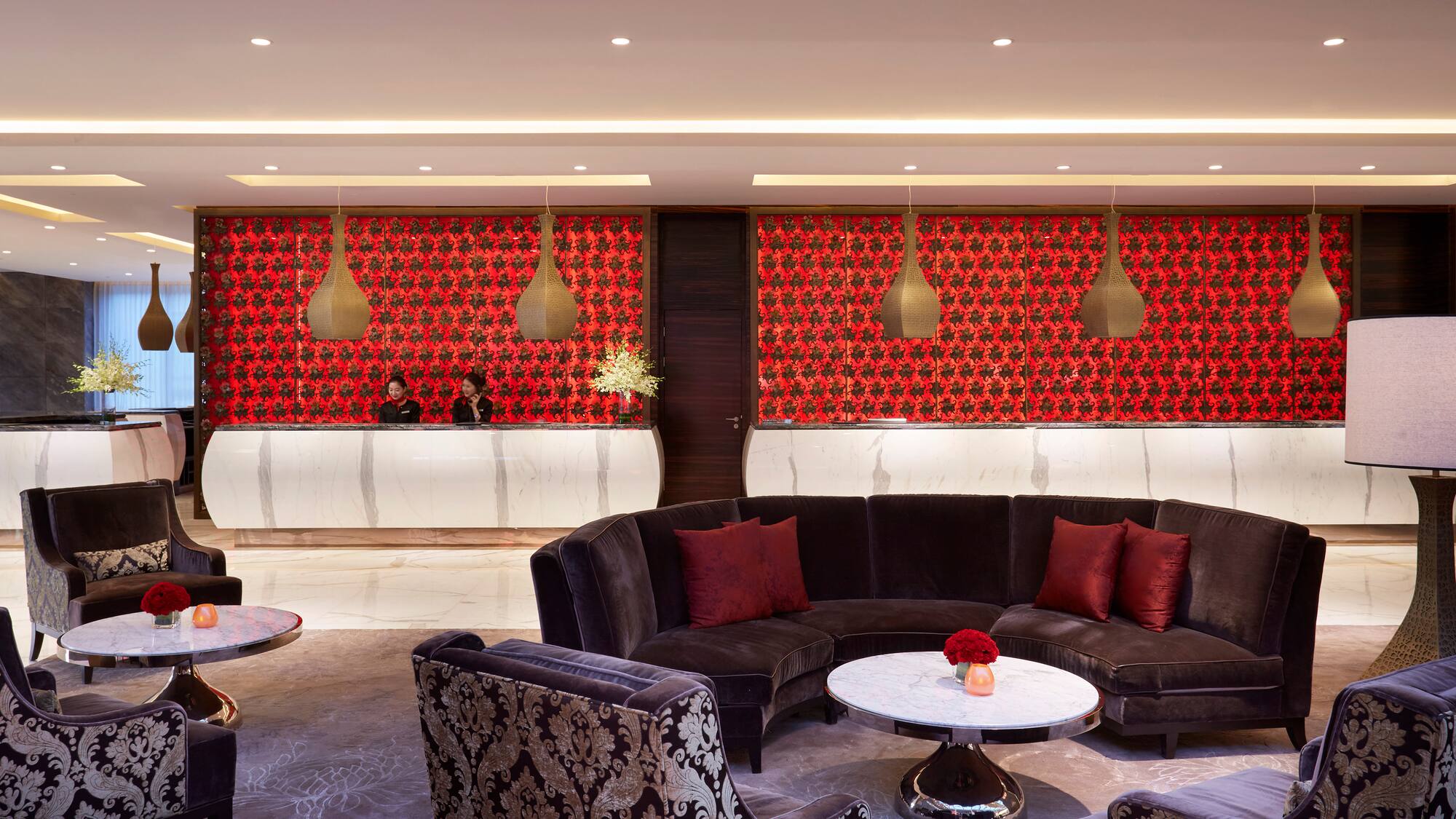 a room with a round table and couches