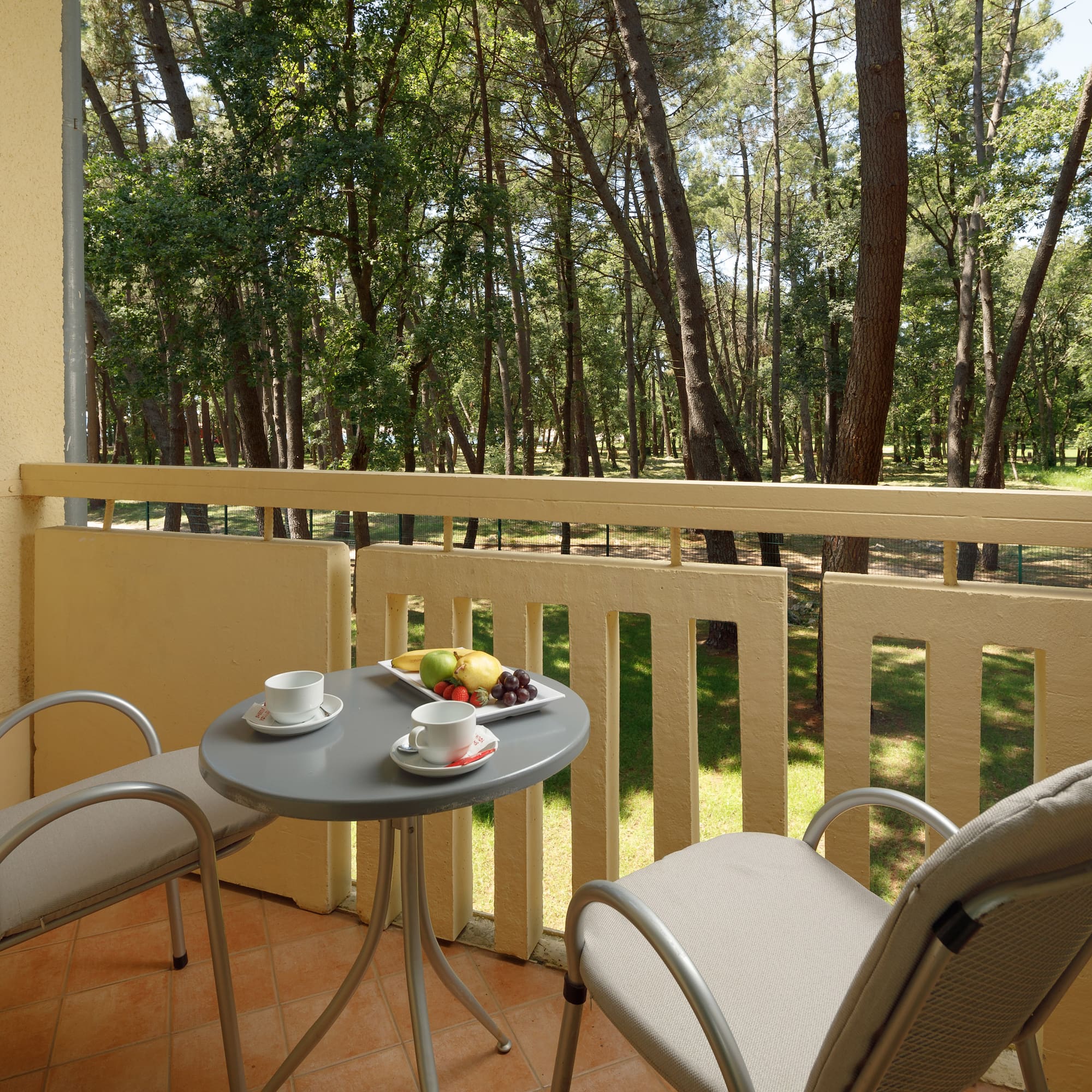 a table and chairs on a balcony