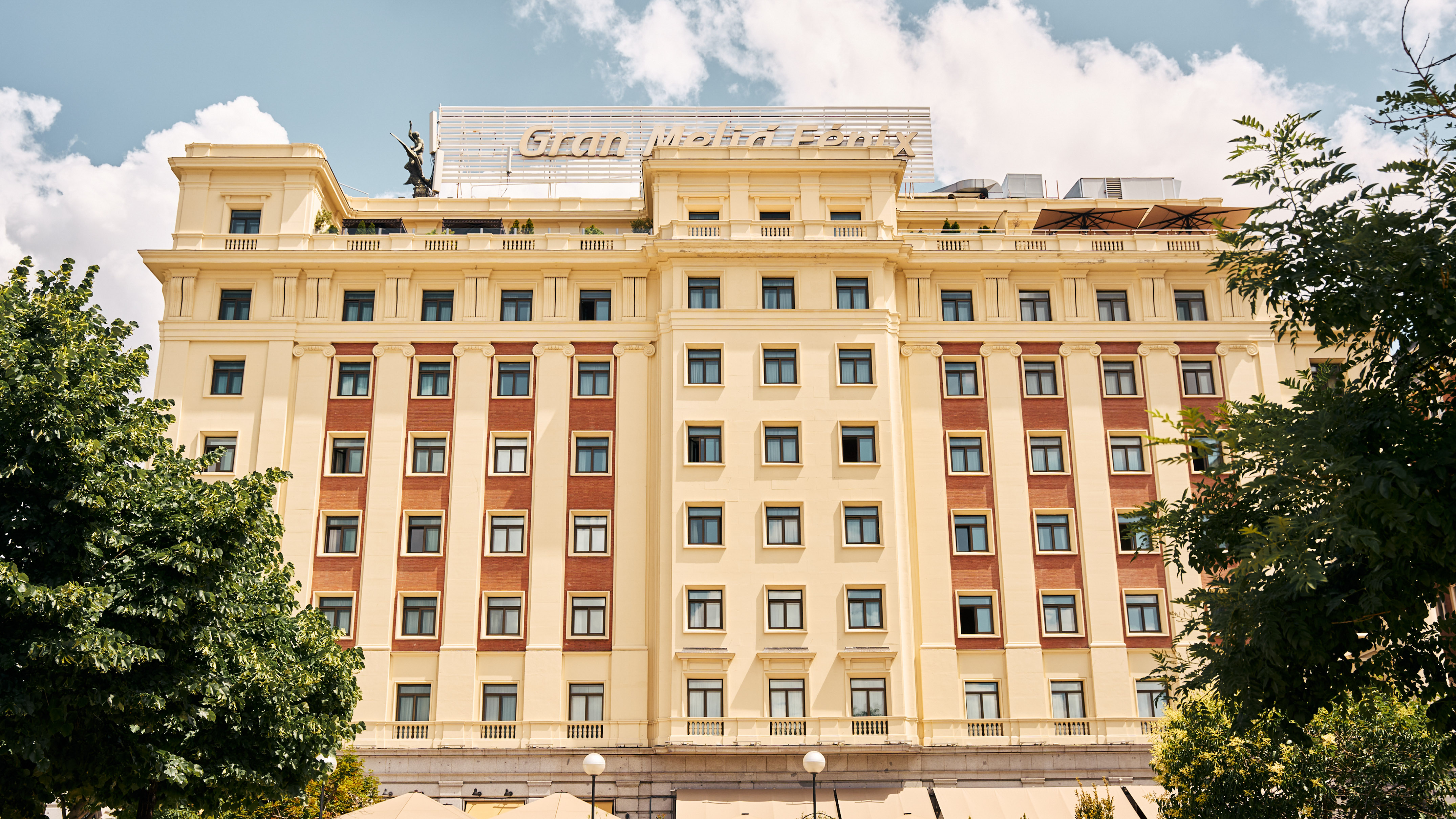 Gran Meliá Fénix hotel in Madrid, cream and red brick facade, rooftop sign.