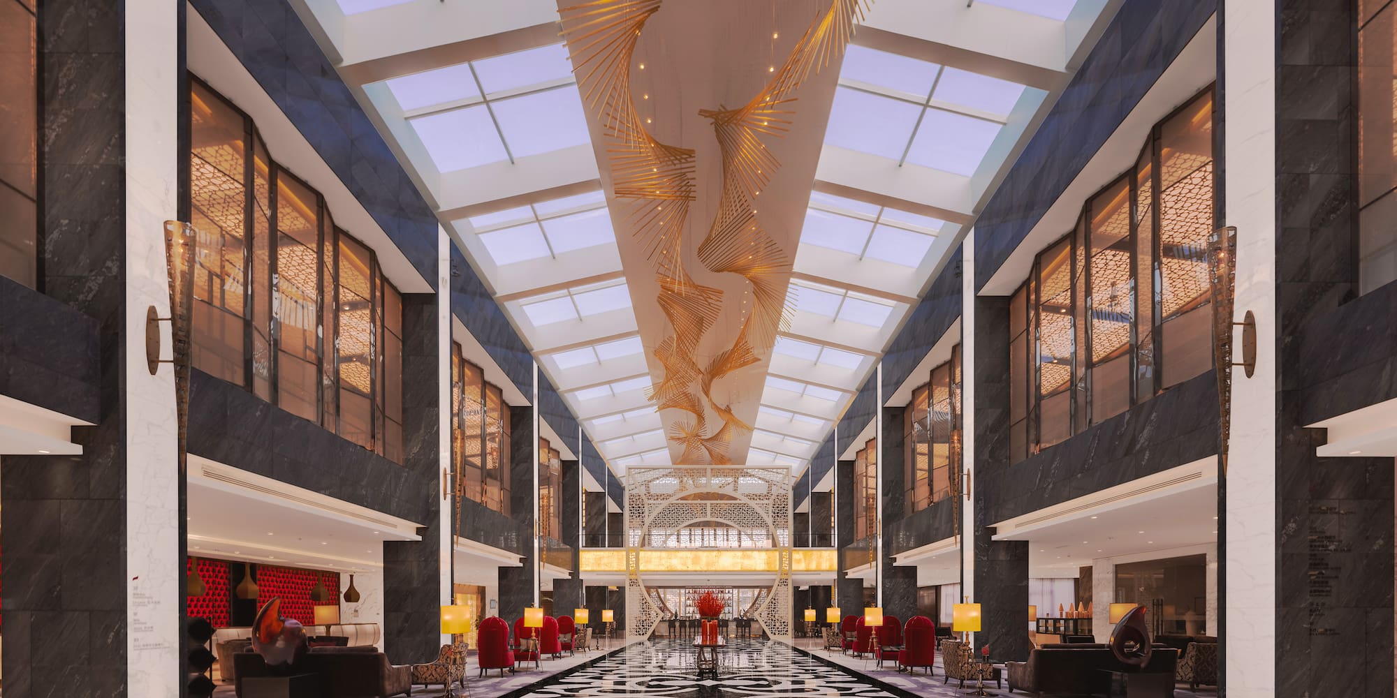 a large lobby with a black and white patterned floor