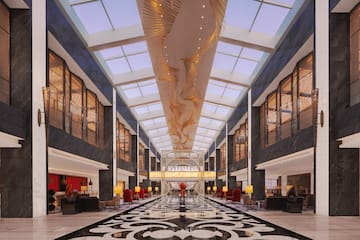 a large lobby with a black and white patterned floor