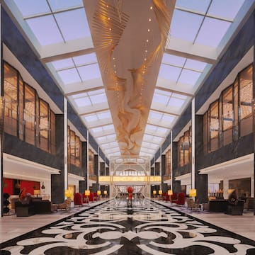 a large lobby with a black and white patterned floor
