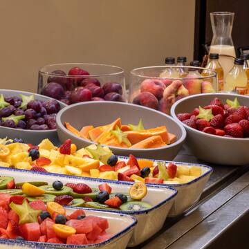 a group of bowls of fruit
