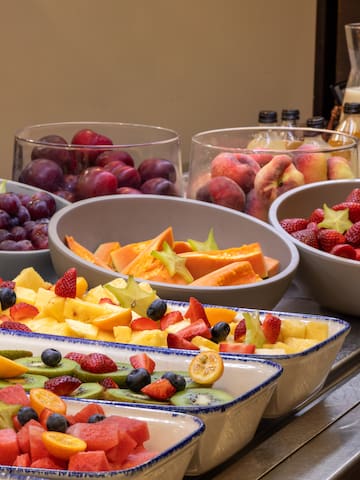 a group of bowls of fruit