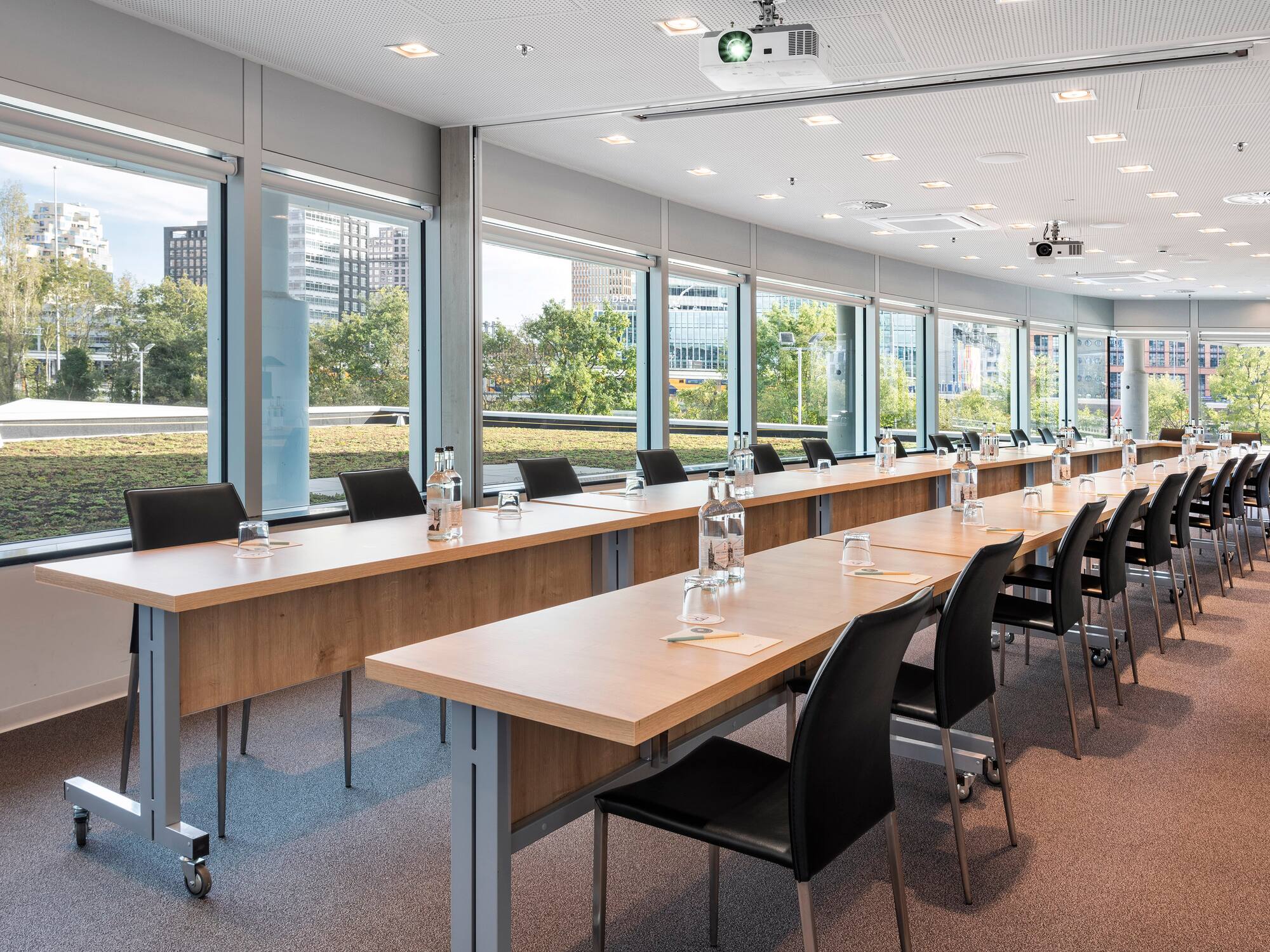 a long conference room with tables and chairs