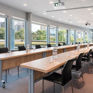a long conference room with tables and chairs