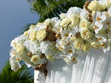 a white and yellow flowers on a white cloth