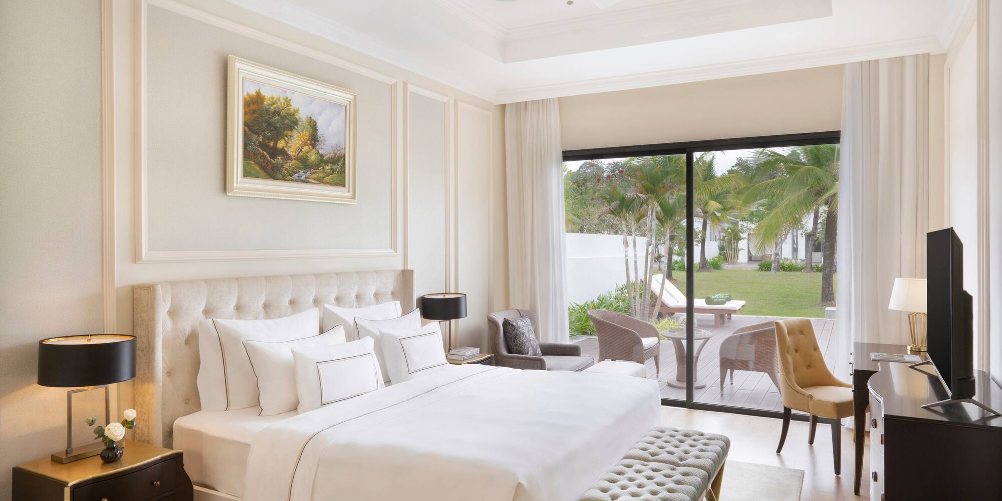 a bedroom with a large bed and a glass door