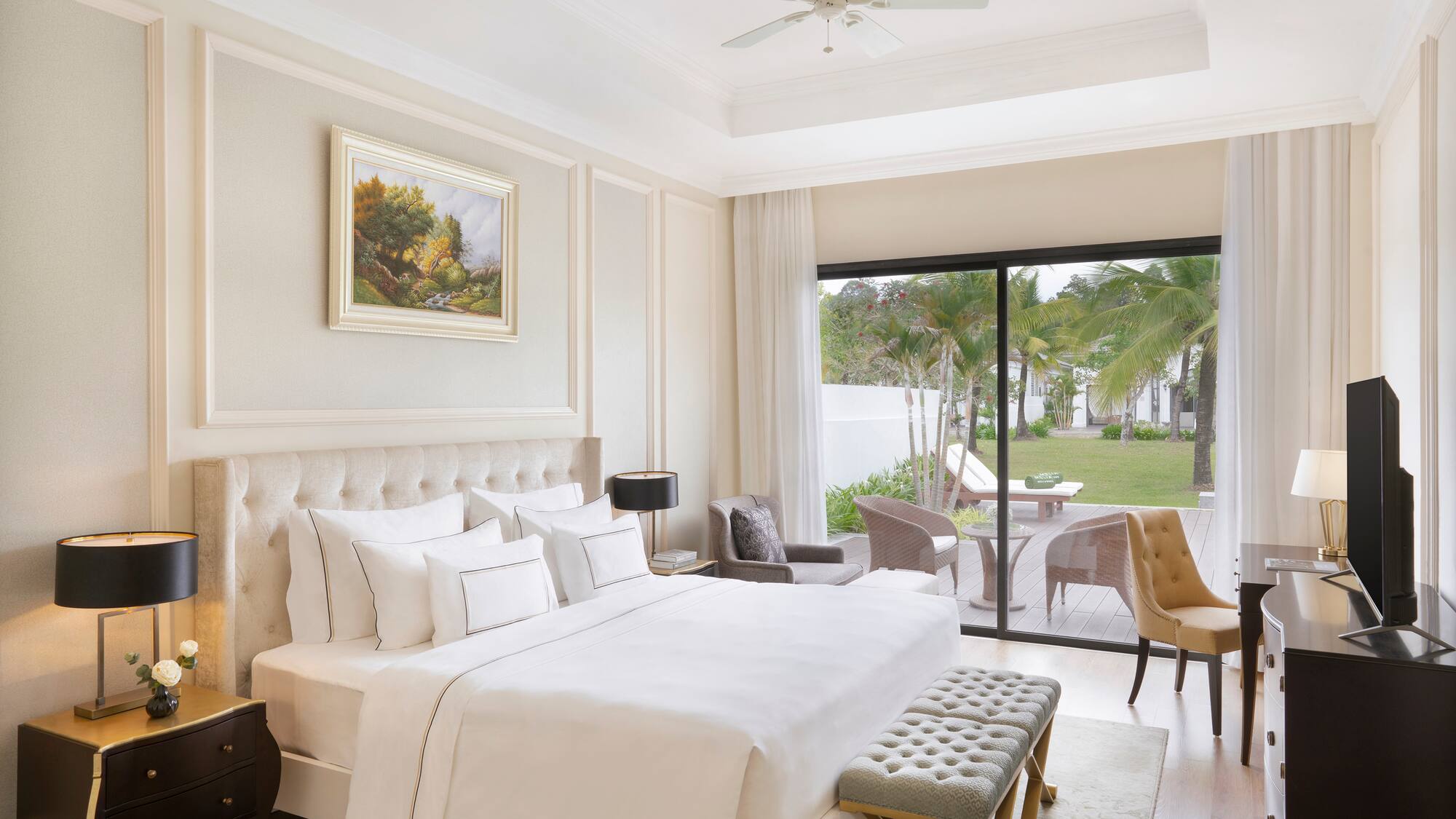 a bedroom with a large bed and a glass door