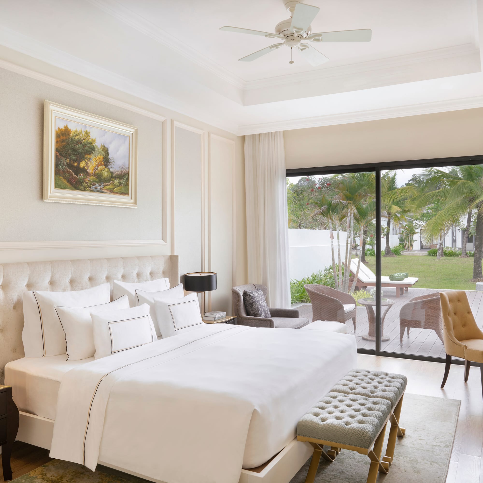 a bedroom with a large bed and a glass door