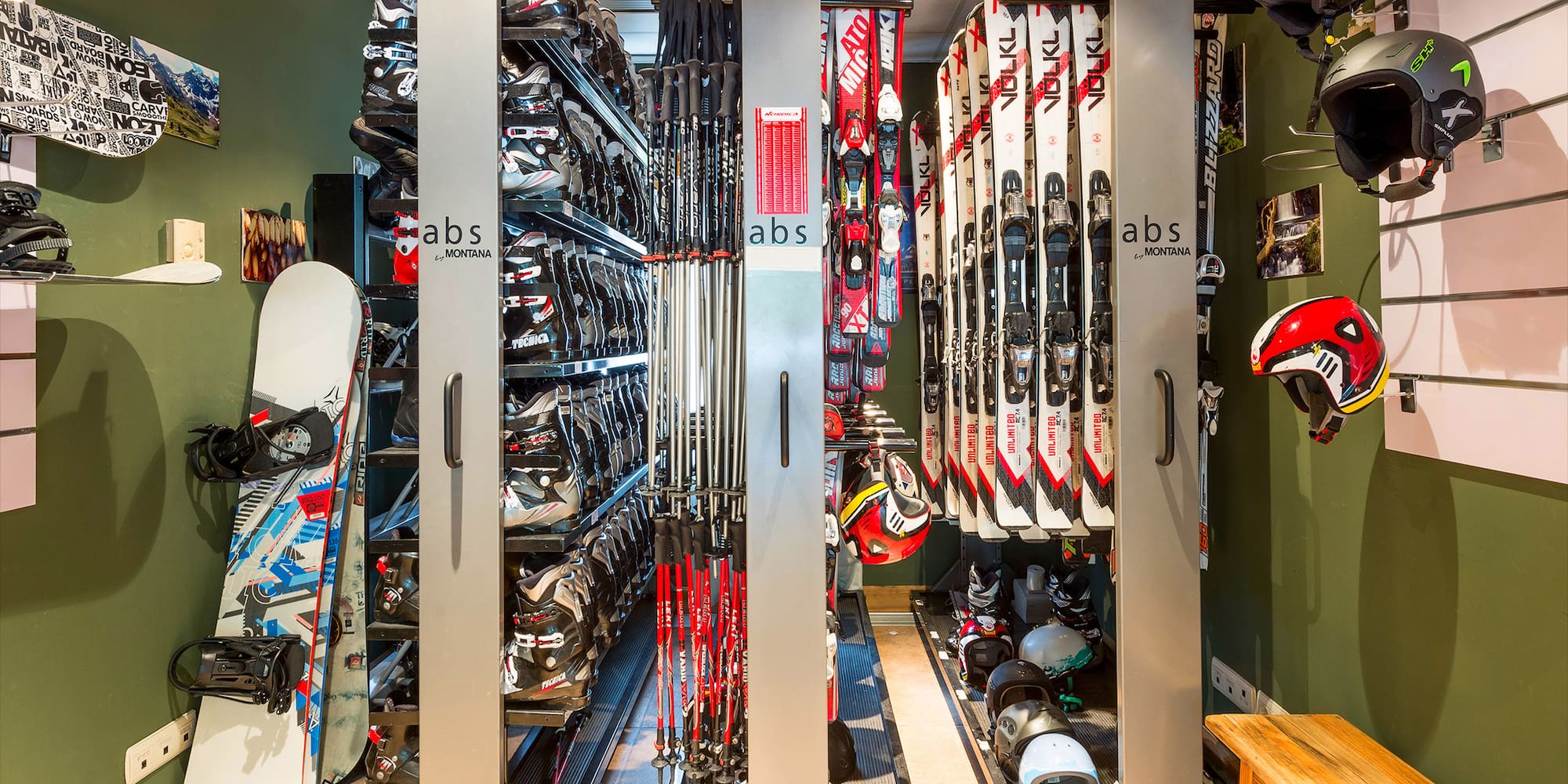 a rack of skis and helmets