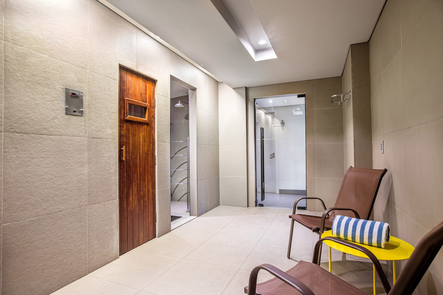 a room with chairs and a door