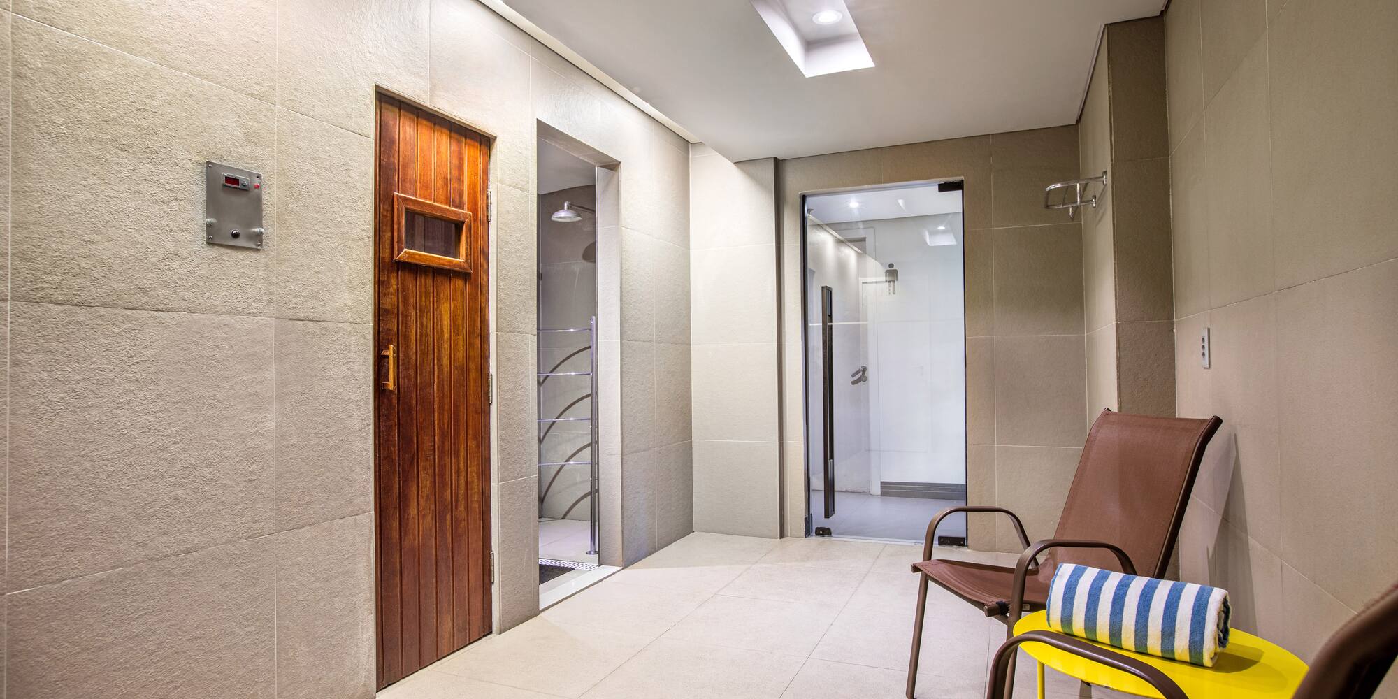 a room with chairs and a door