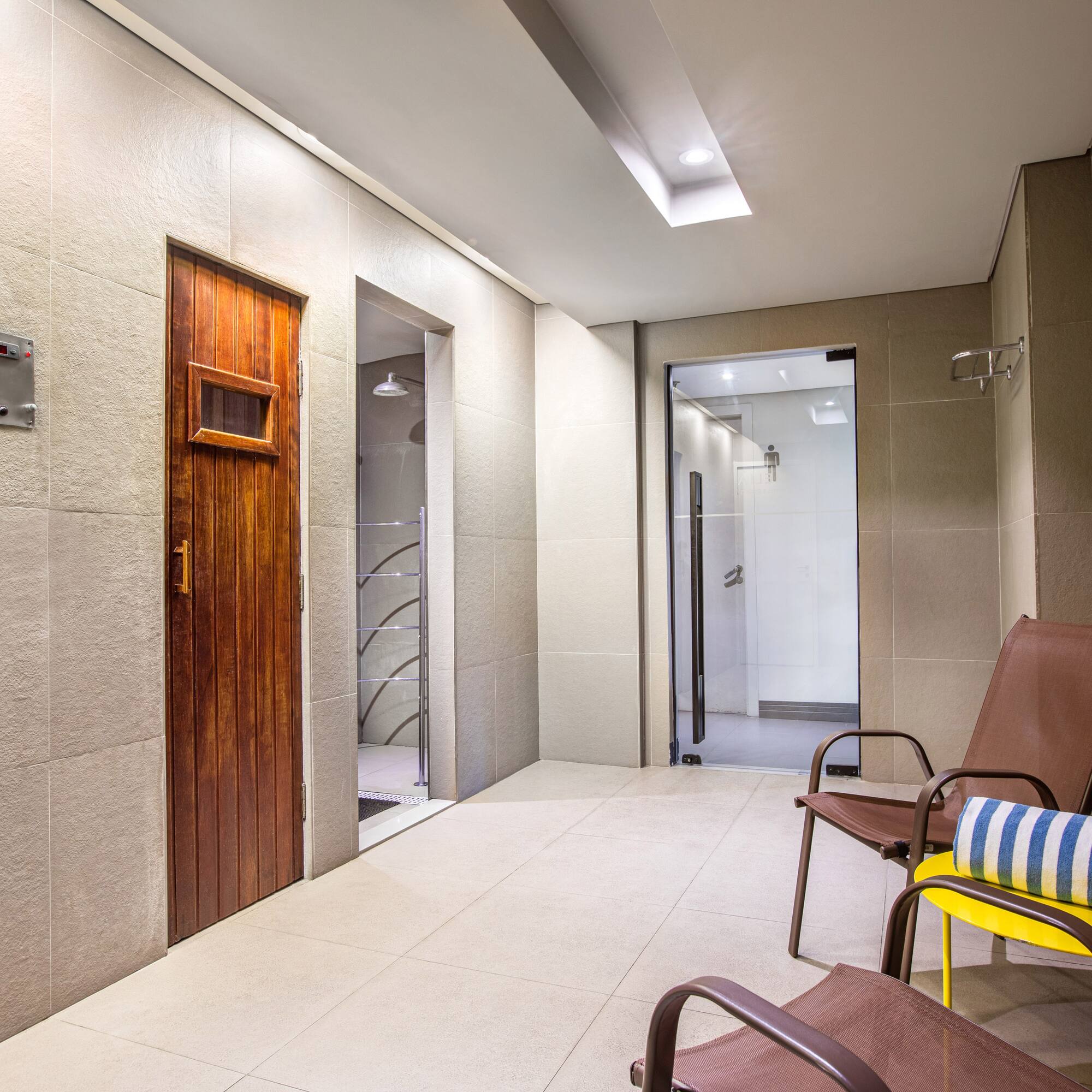 a room with chairs and a door