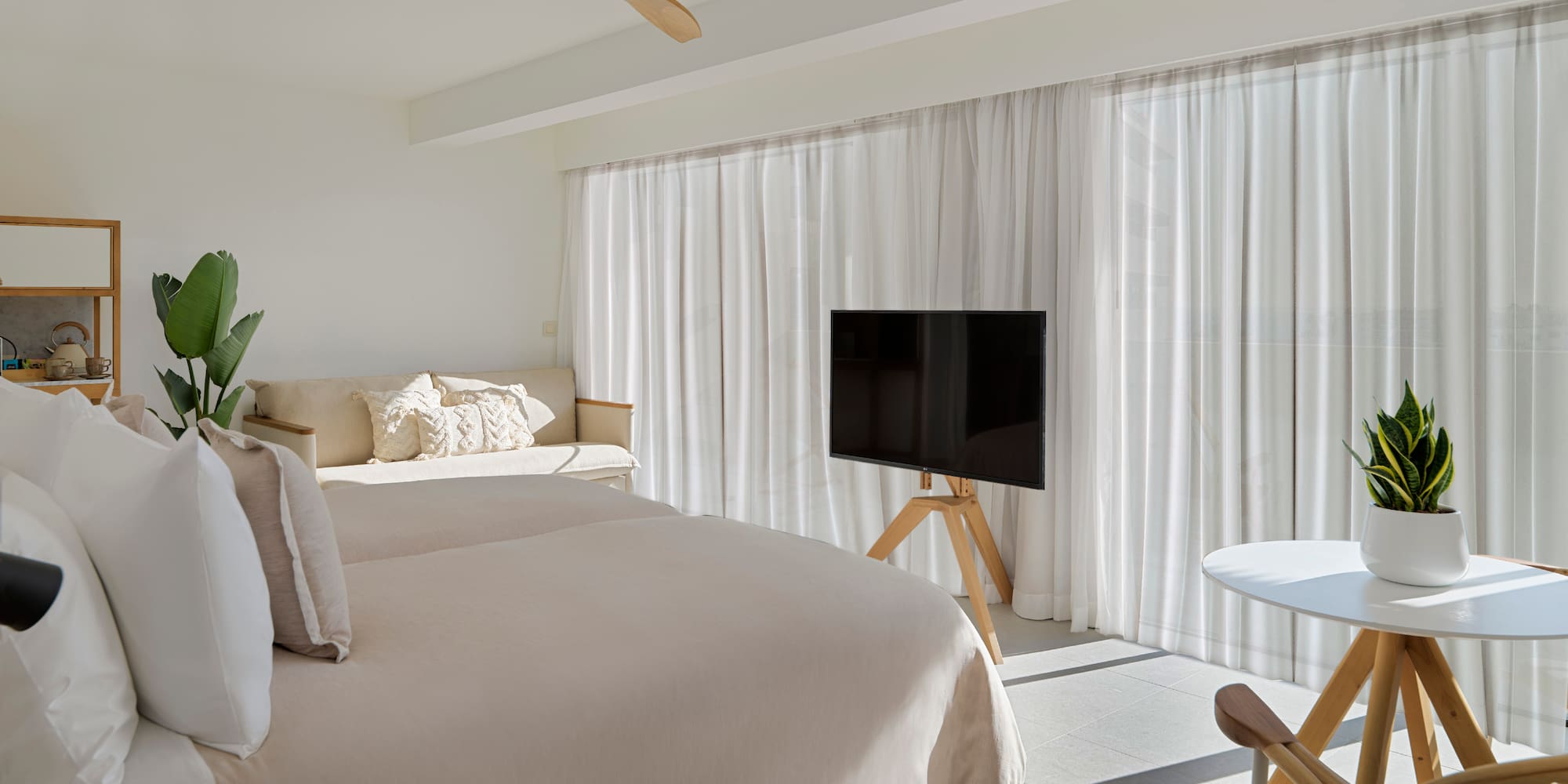 a room with a bed and a tv