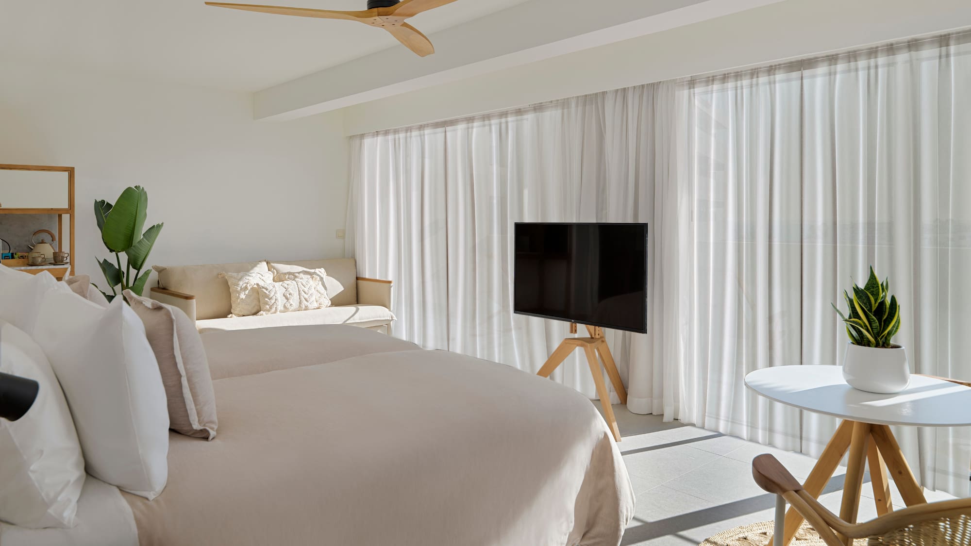 a room with a bed and a tv