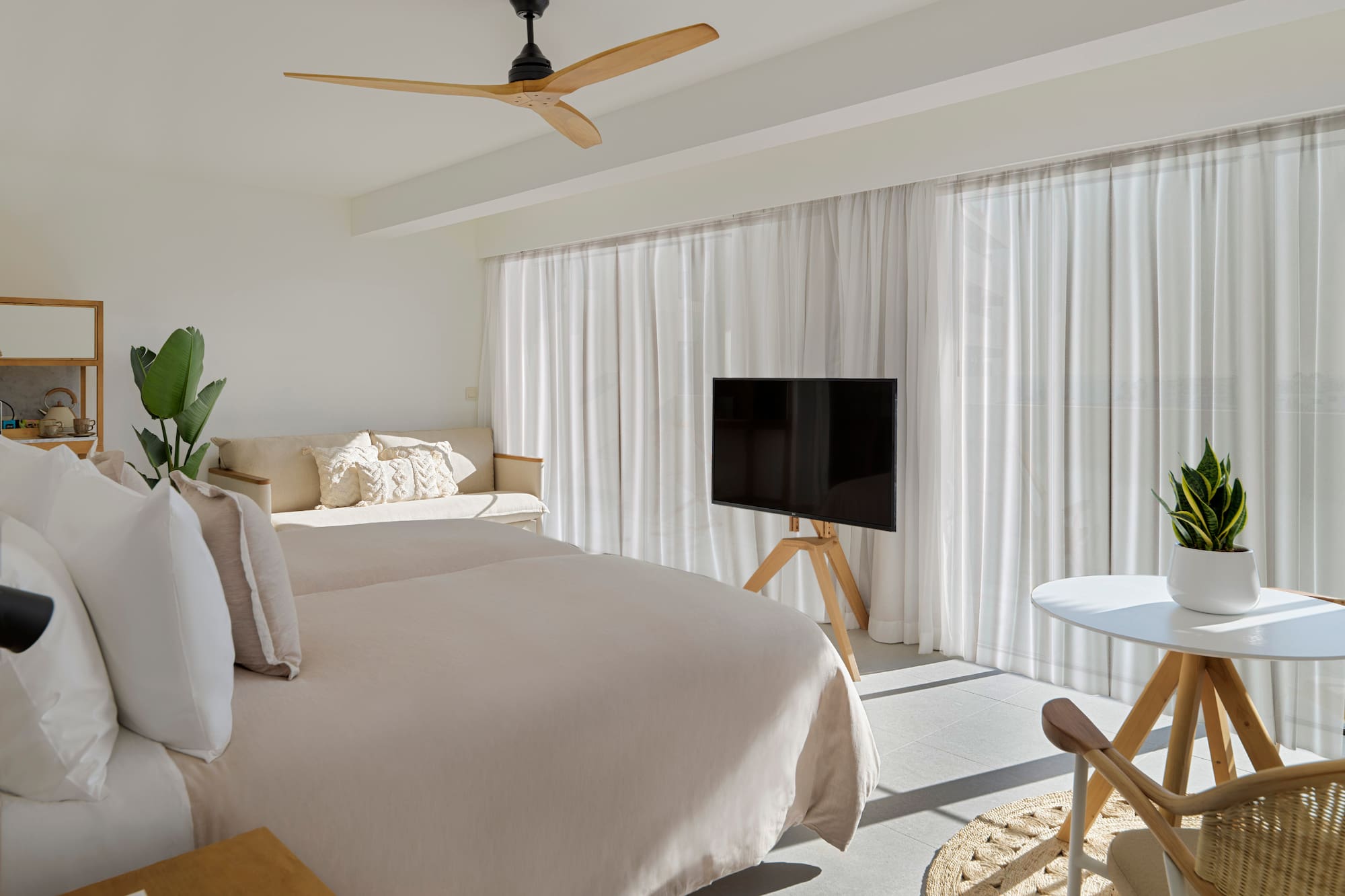 a room with a bed and a tv