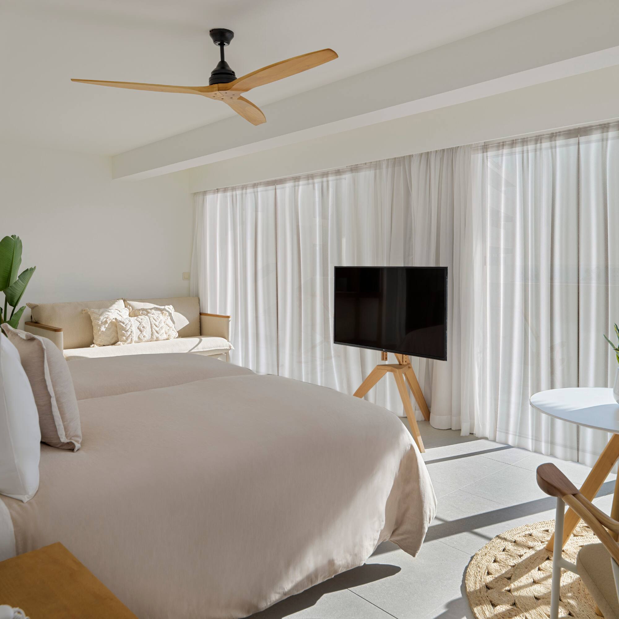 a room with a bed and a tv