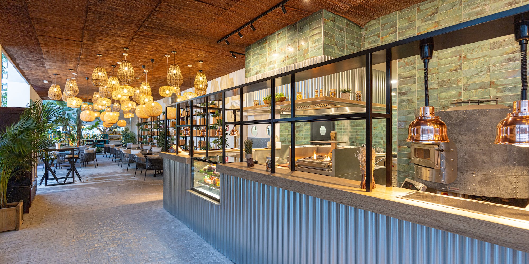 a restaurant with a glass wall and a ceiling