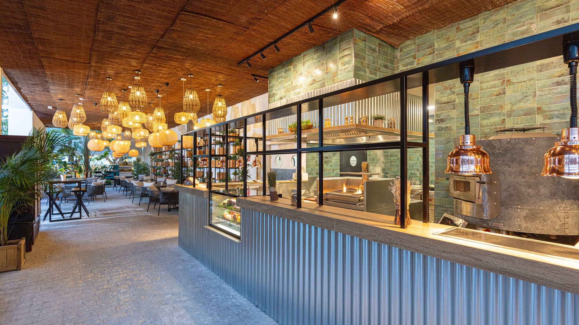 a restaurant with a glass wall and a ceiling