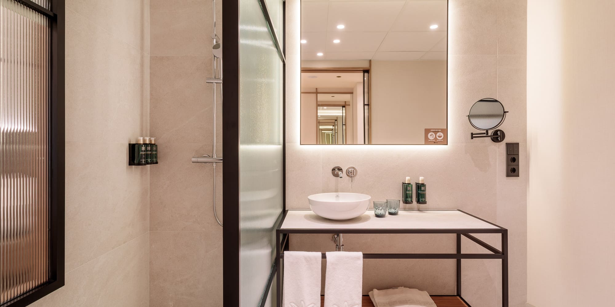 a bathroom with a mirror and sink