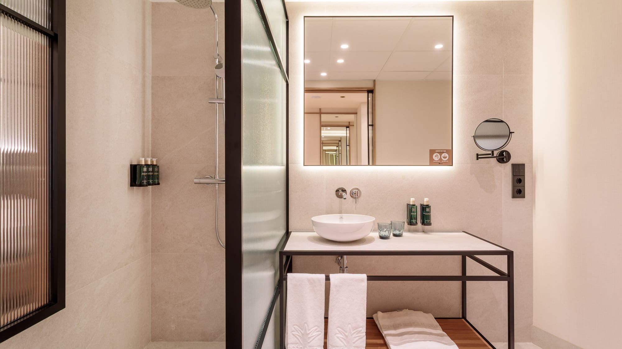 a bathroom with a mirror and sink