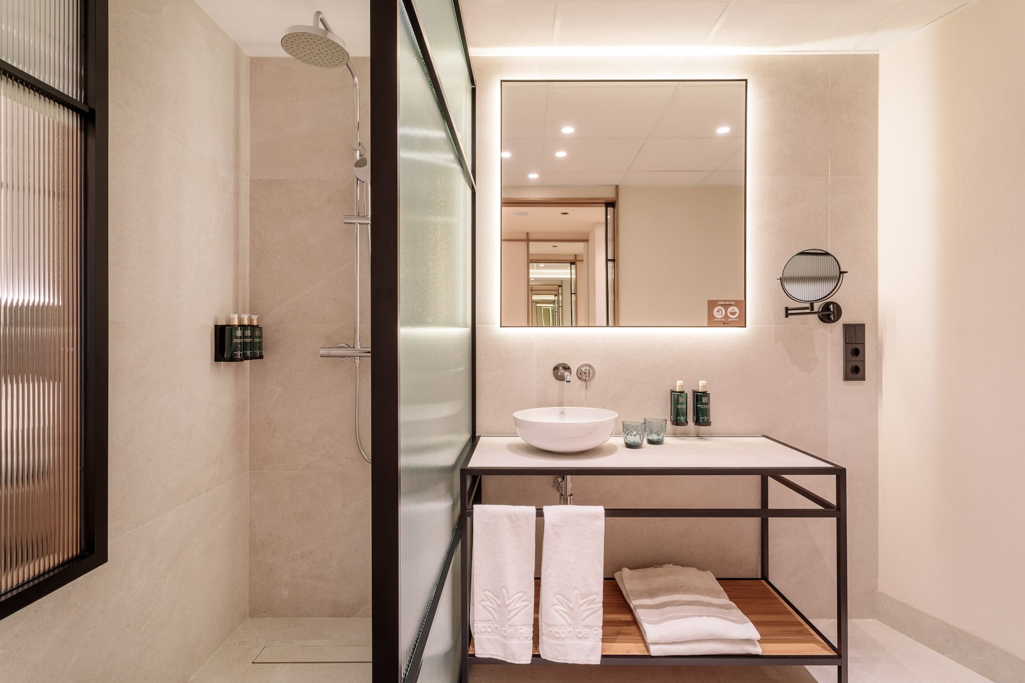 a bathroom with a mirror and sink