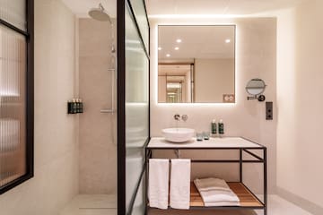 a bathroom with a mirror and sink