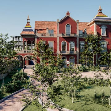 a large red building with trees and a path