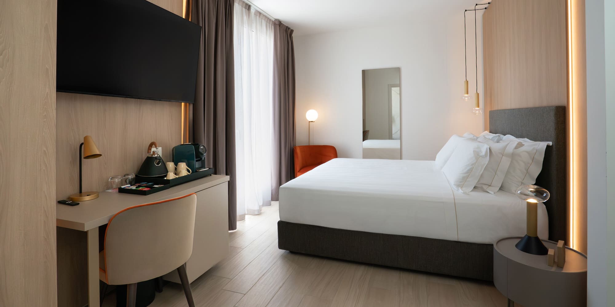 a room with a bed and a desk