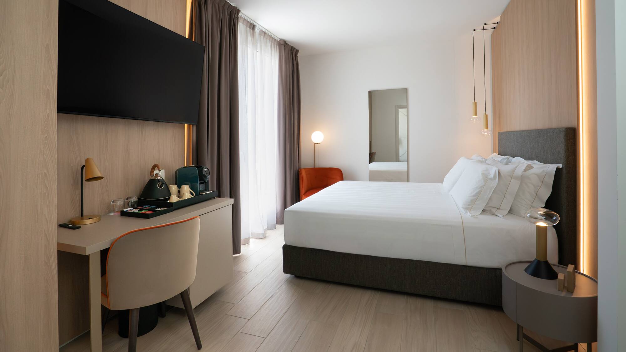 a room with a bed and a desk