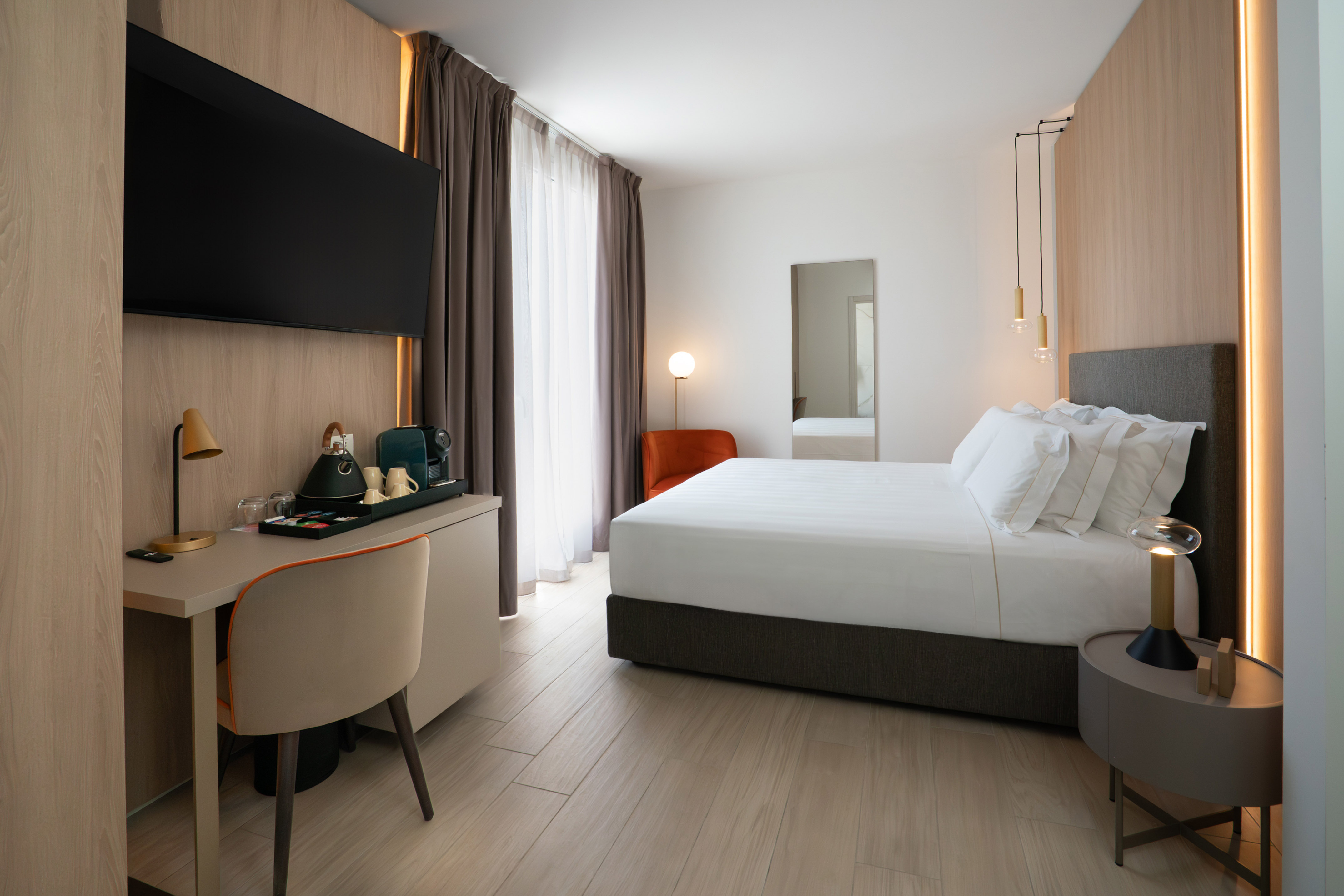 a room with a bed and a desk