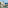 Luxury resort with ocean view, pool, palm trees, and boats.