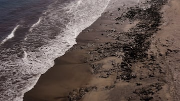 a beach with waves crashing on the shore
