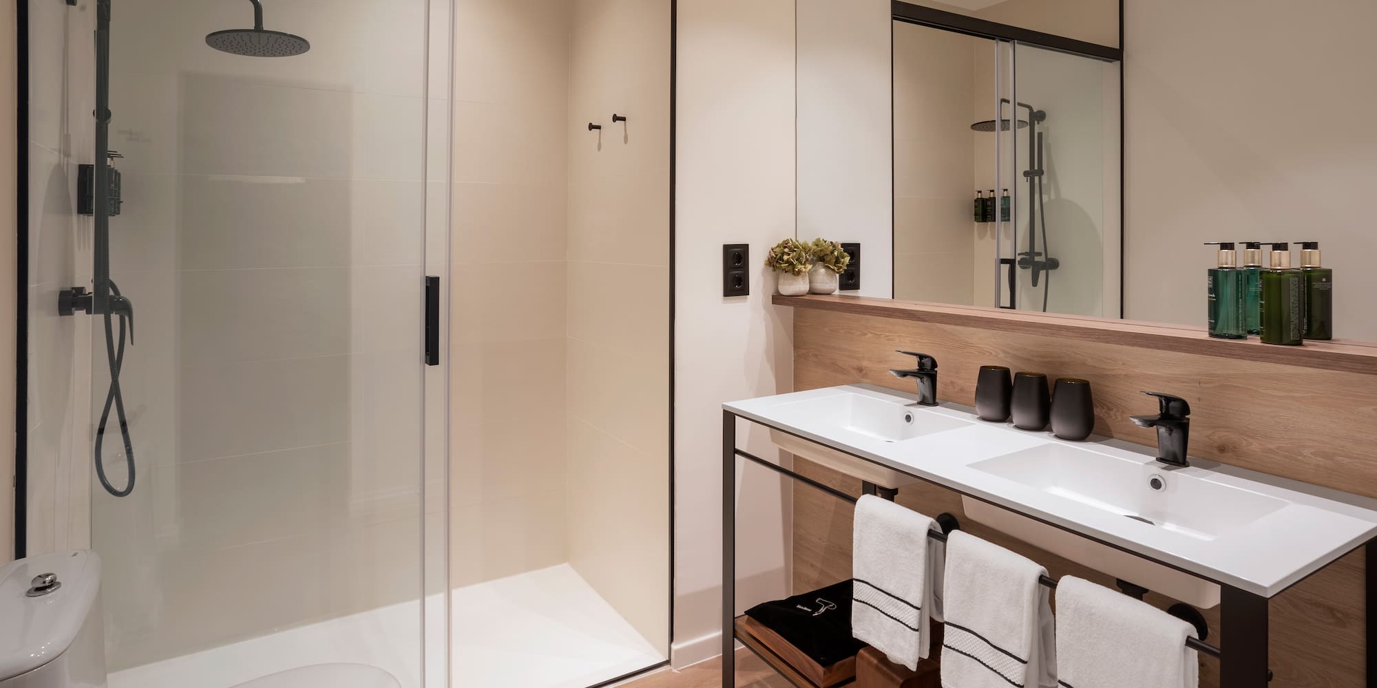 a bathroom with a shower and sink