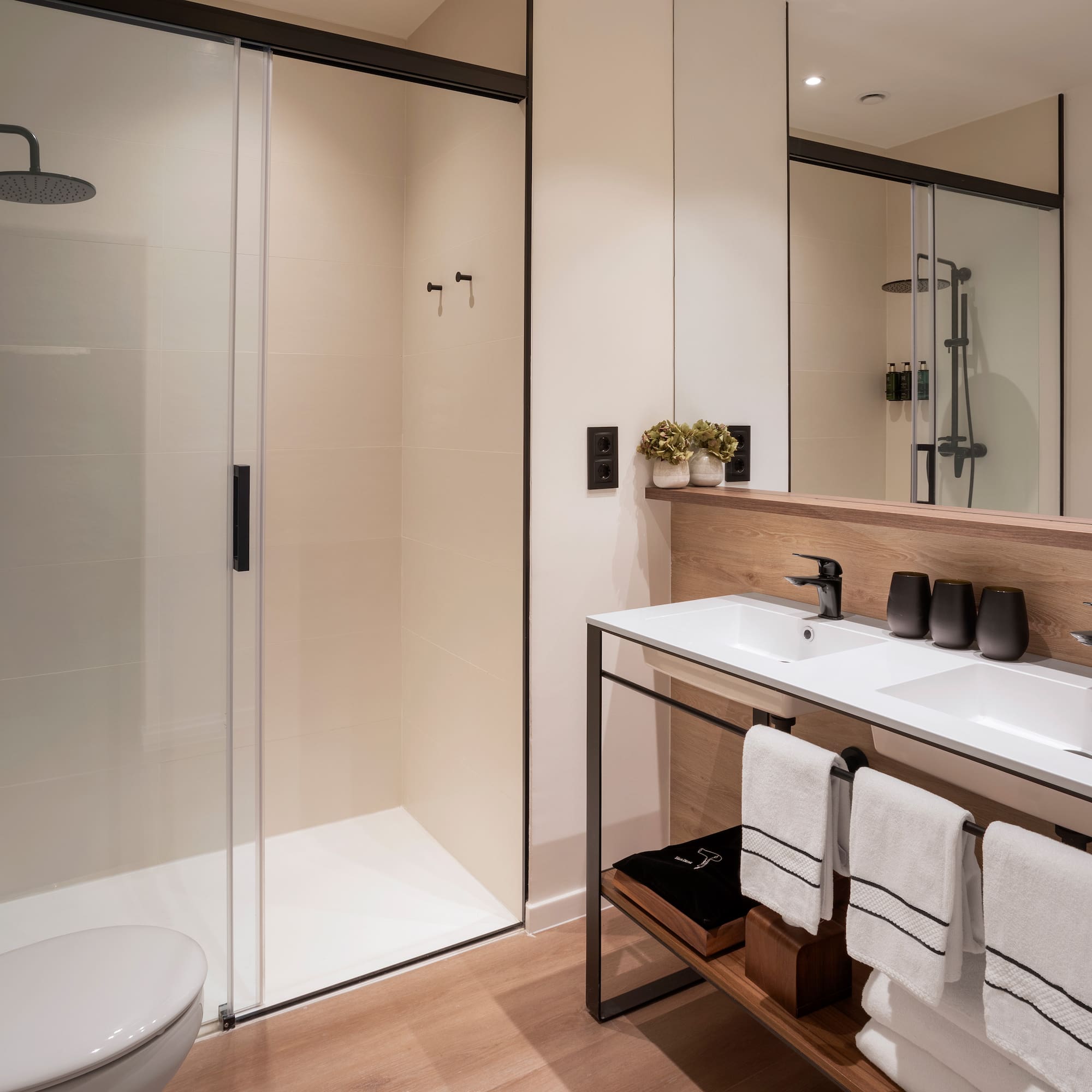 a bathroom with a shower and sink