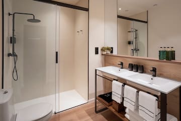 a bathroom with a shower and sink