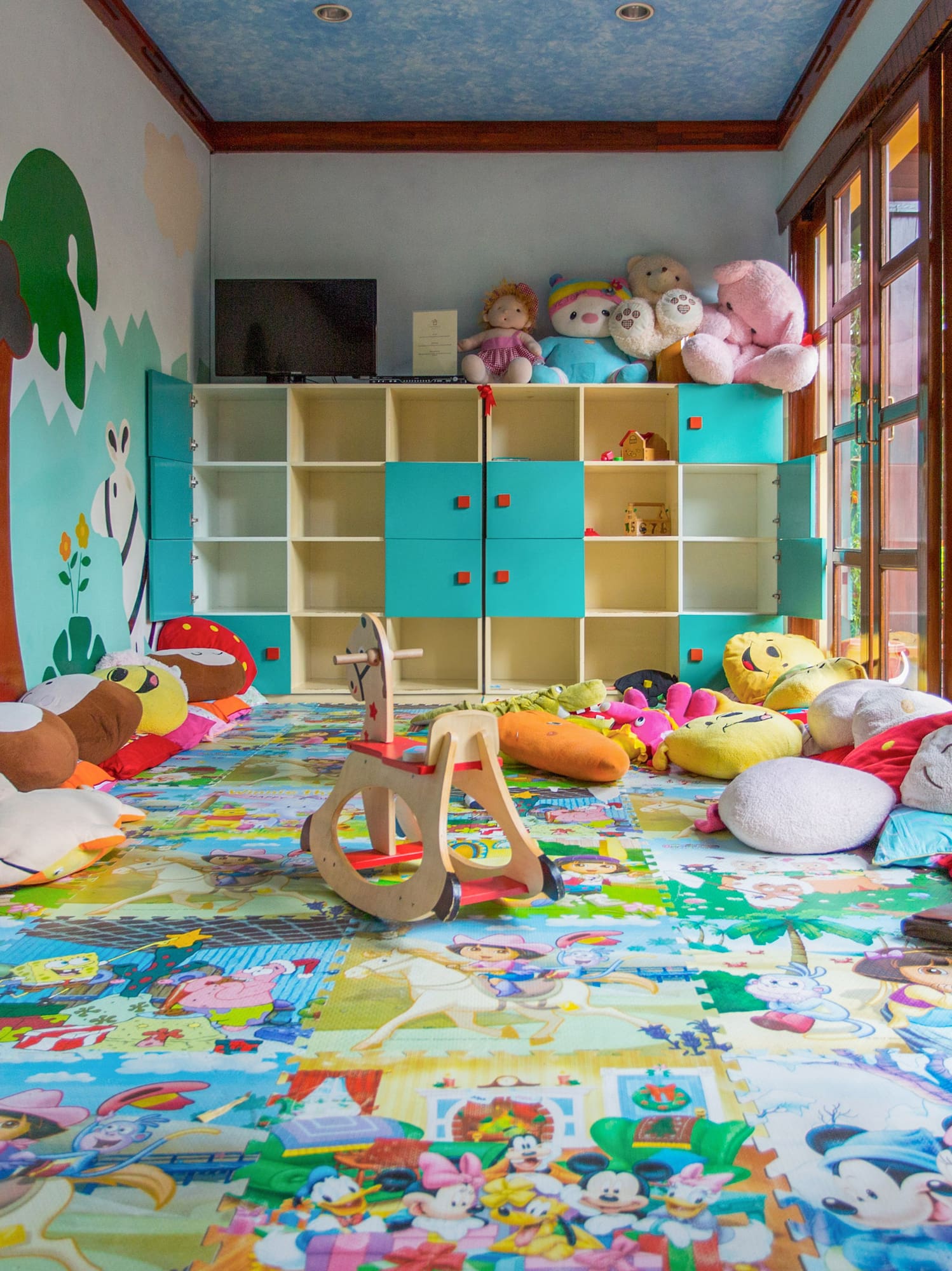 a room with many stuffed animals and toys