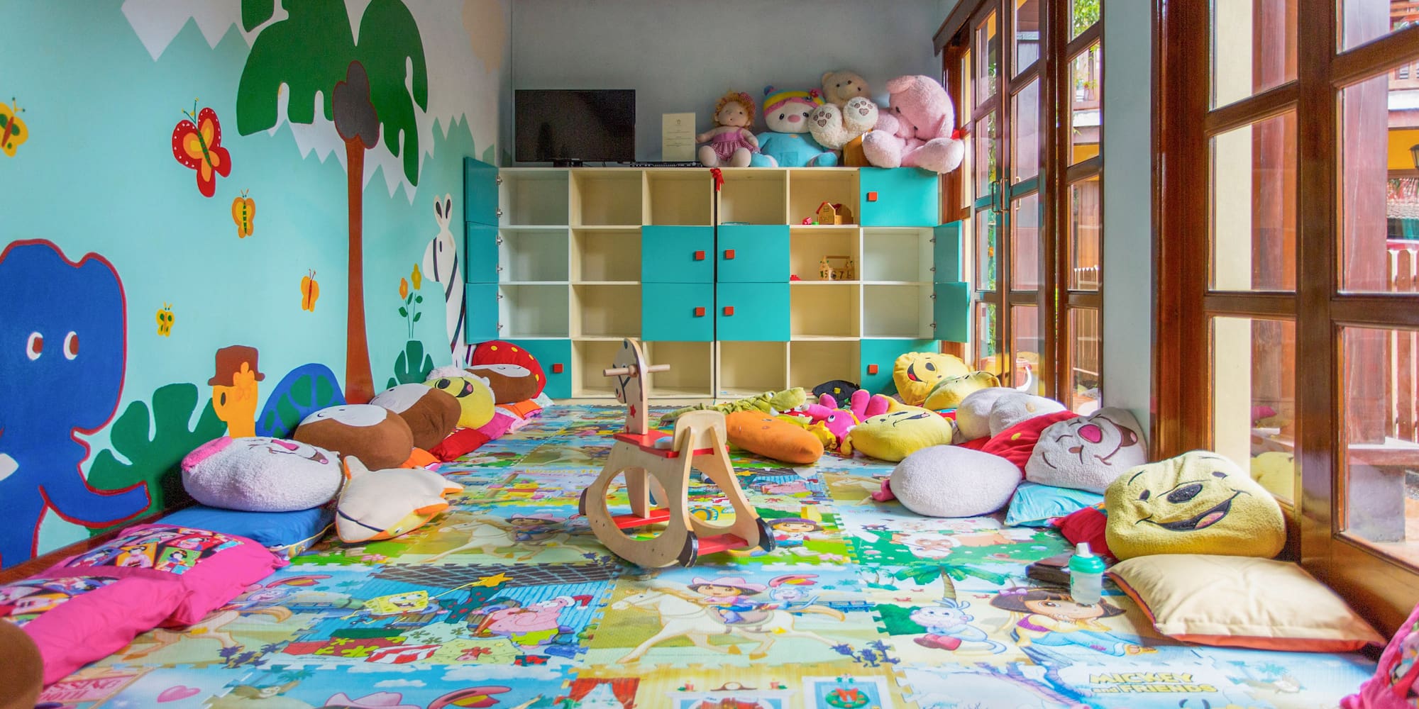 a room with many stuffed animals and toys
