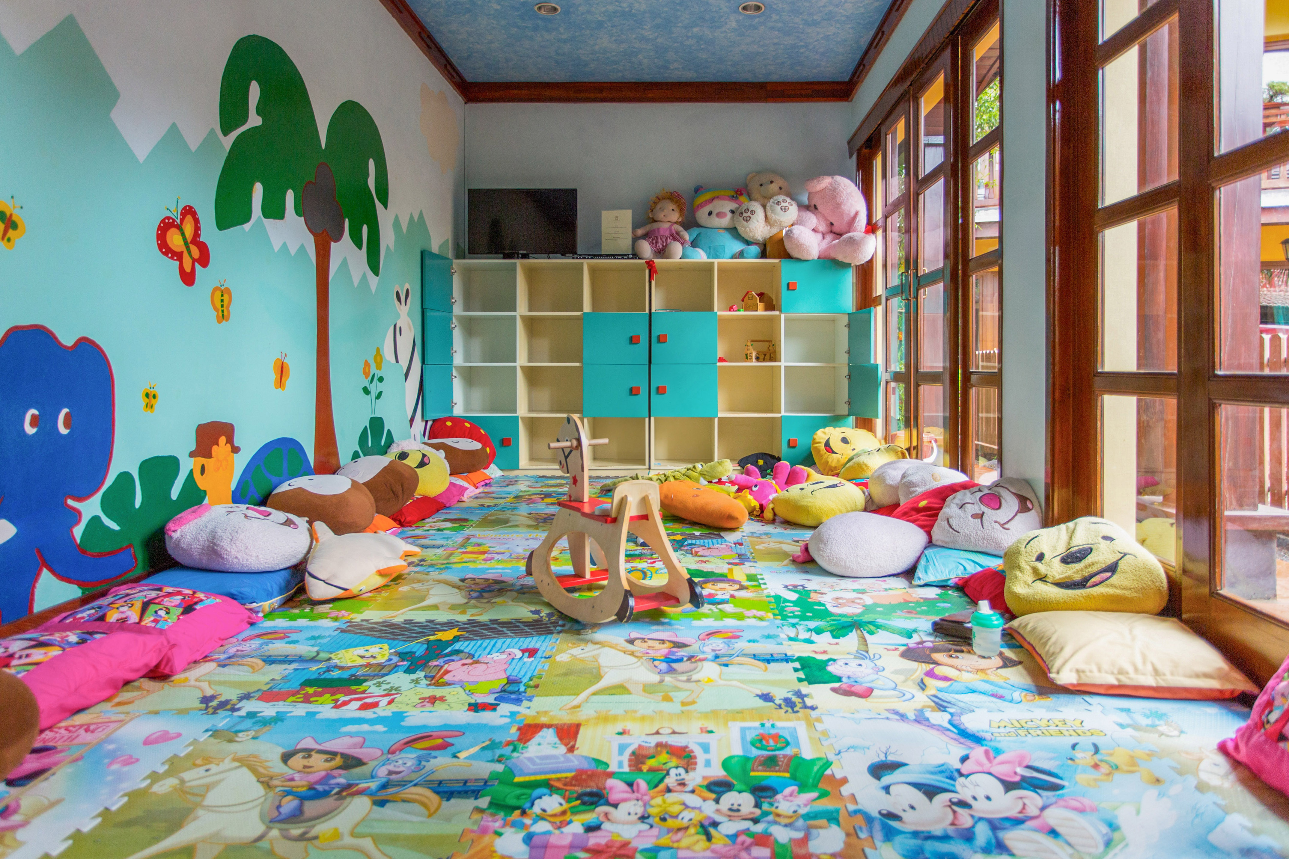 a room with many stuffed animals and toys