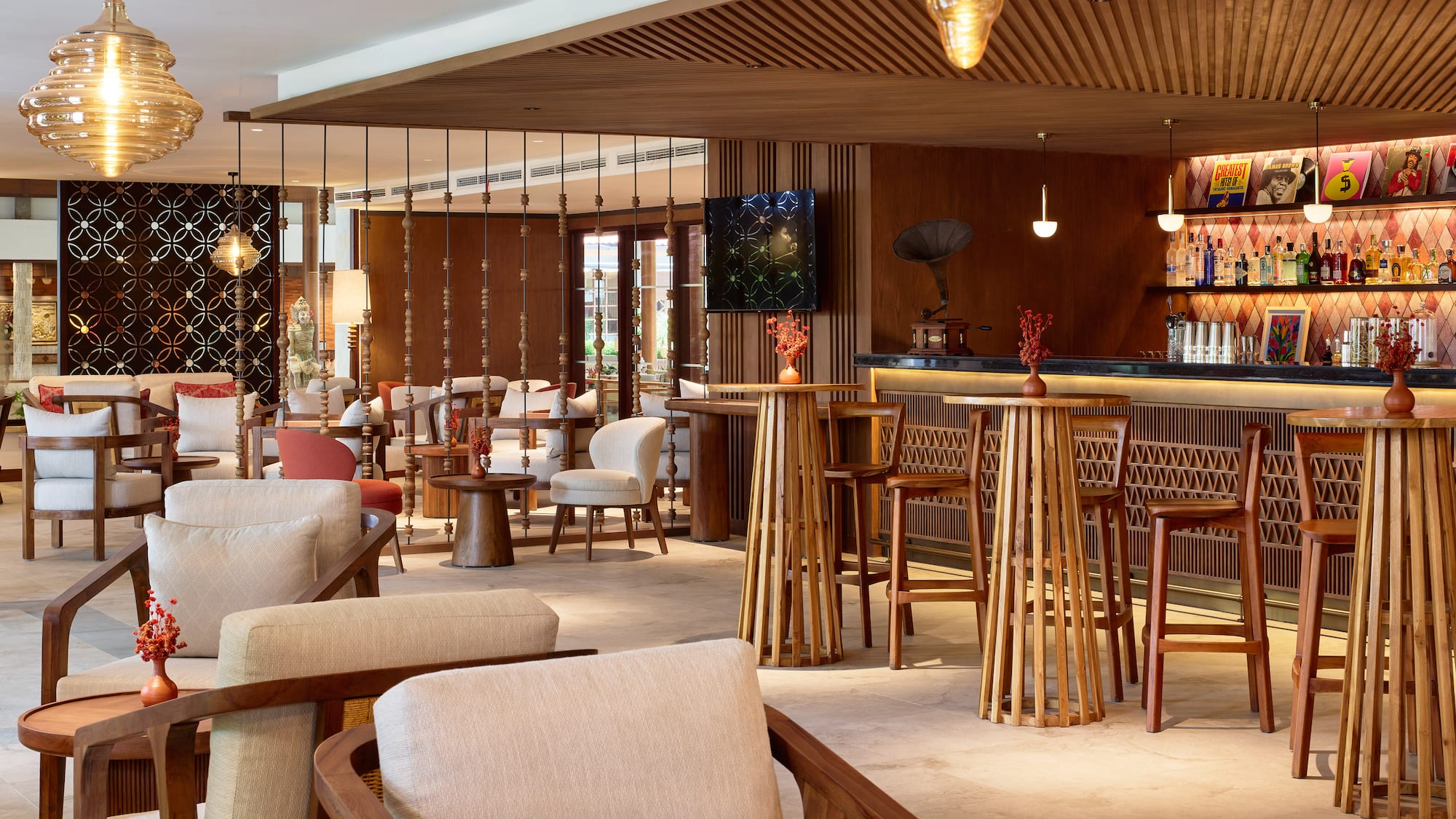 a room with a bar and chairs