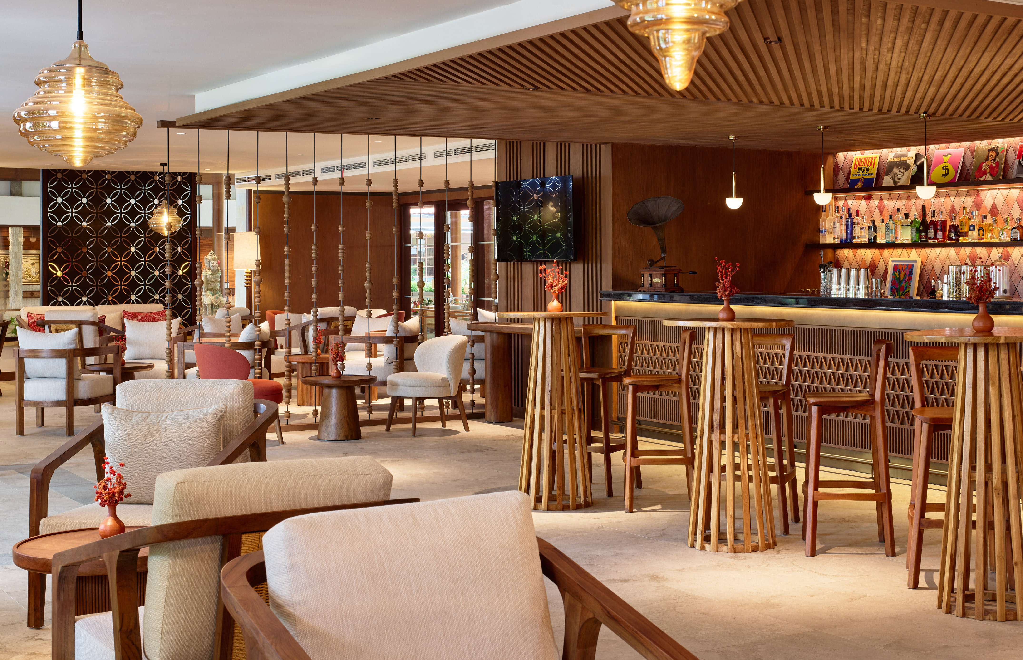 a room with a bar and chairs