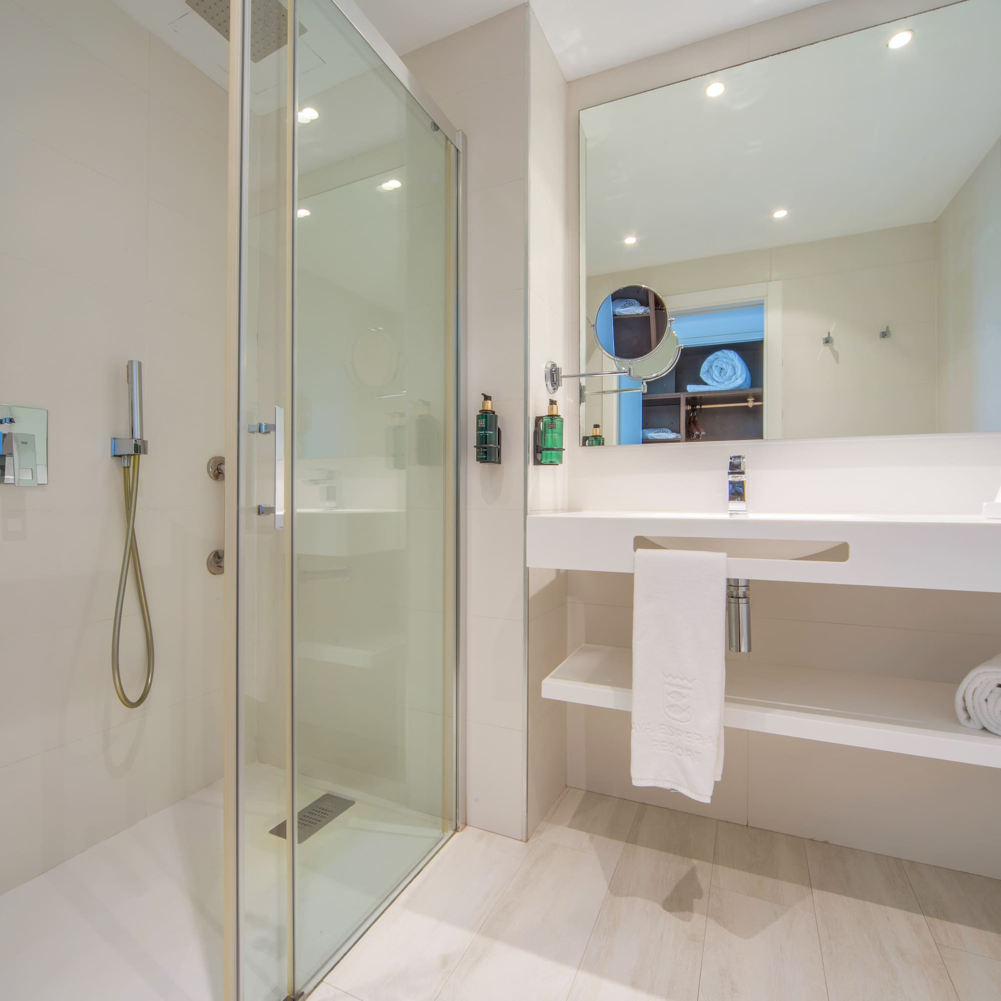 a bathroom with a shower and sink