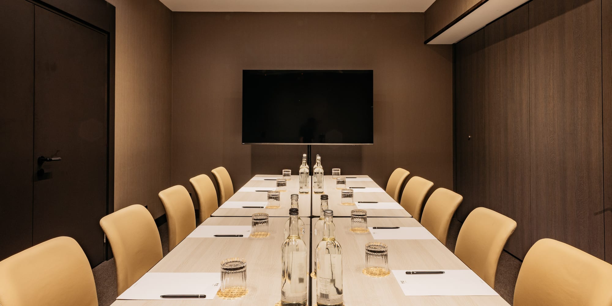 a room with a table and chairs