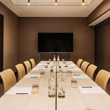 a room with a table and chairs