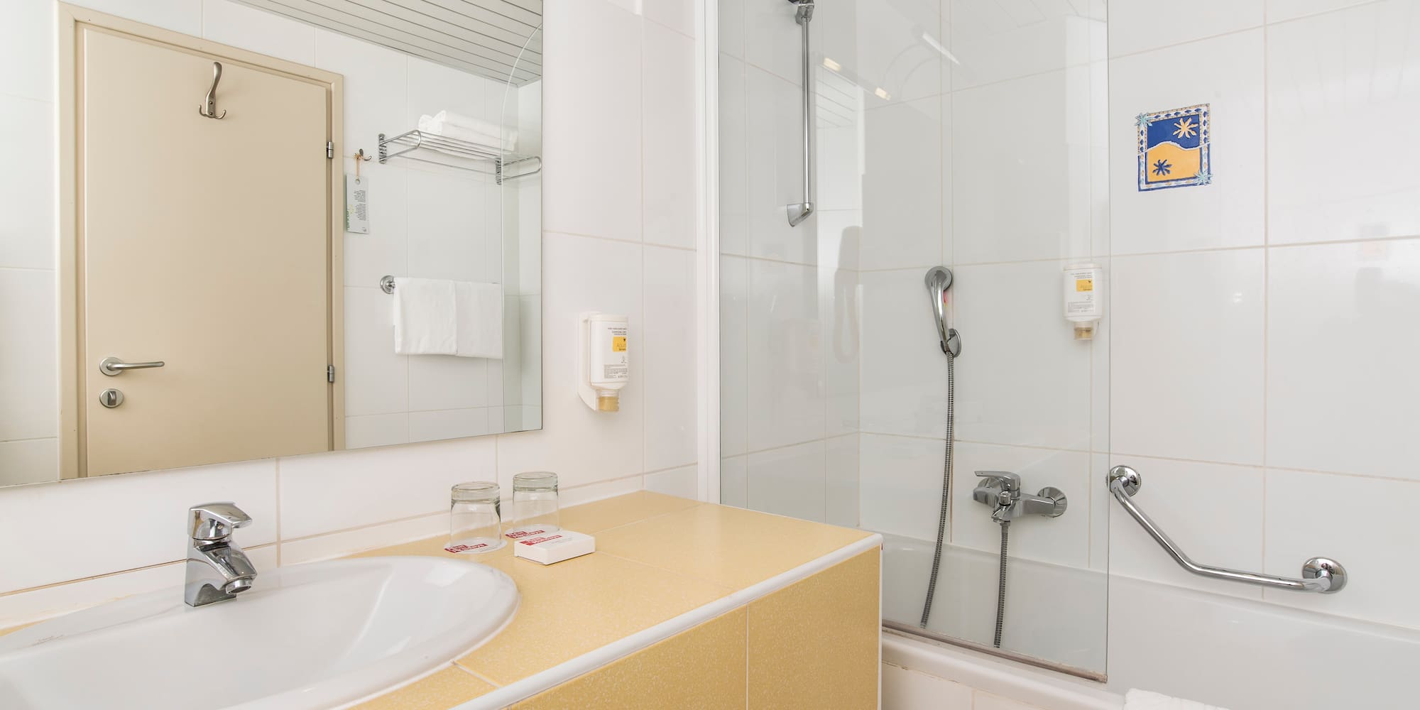 a bathroom with a shower and sink