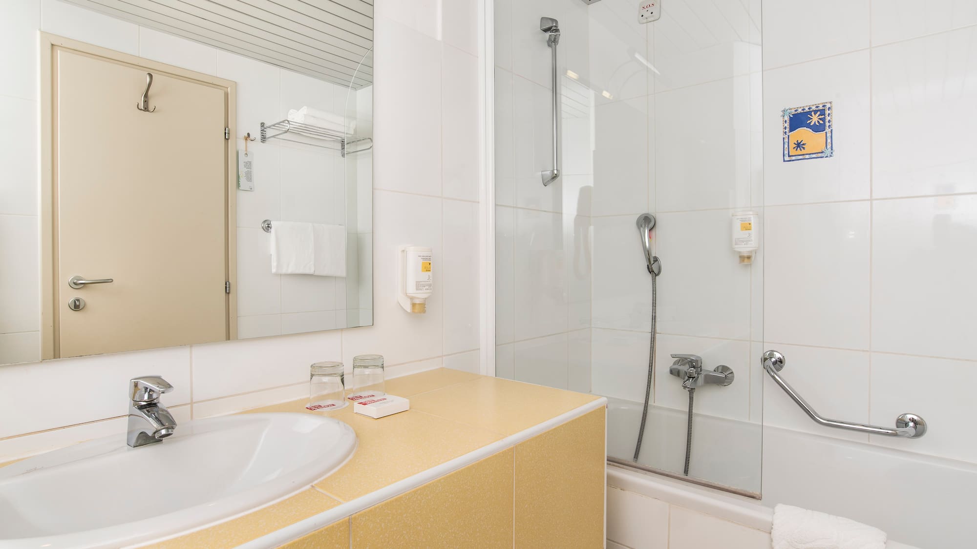 a bathroom with a shower and sink