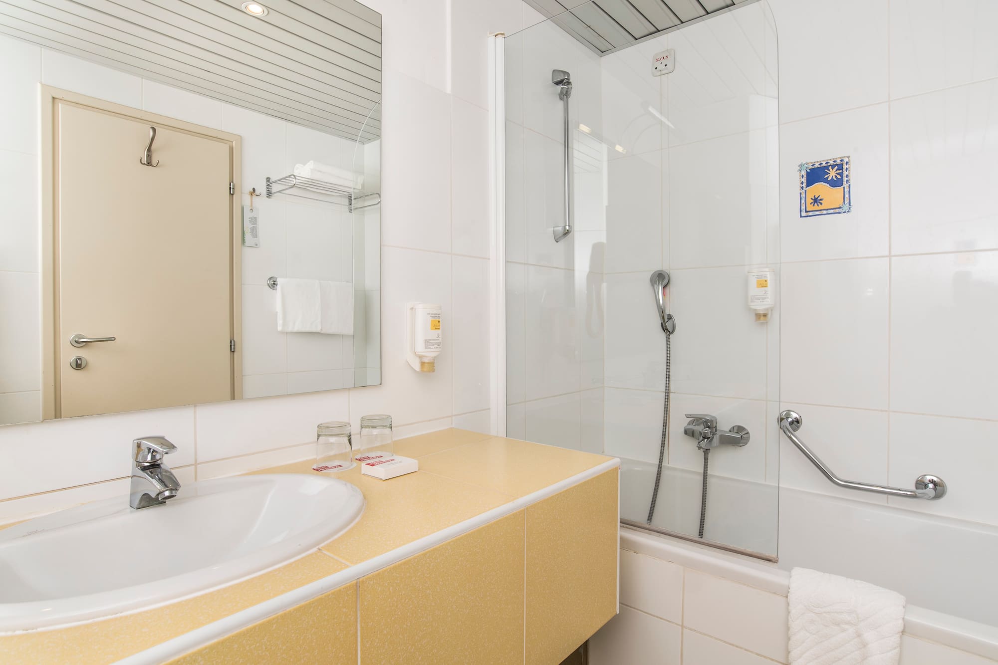 a bathroom with a shower and sink