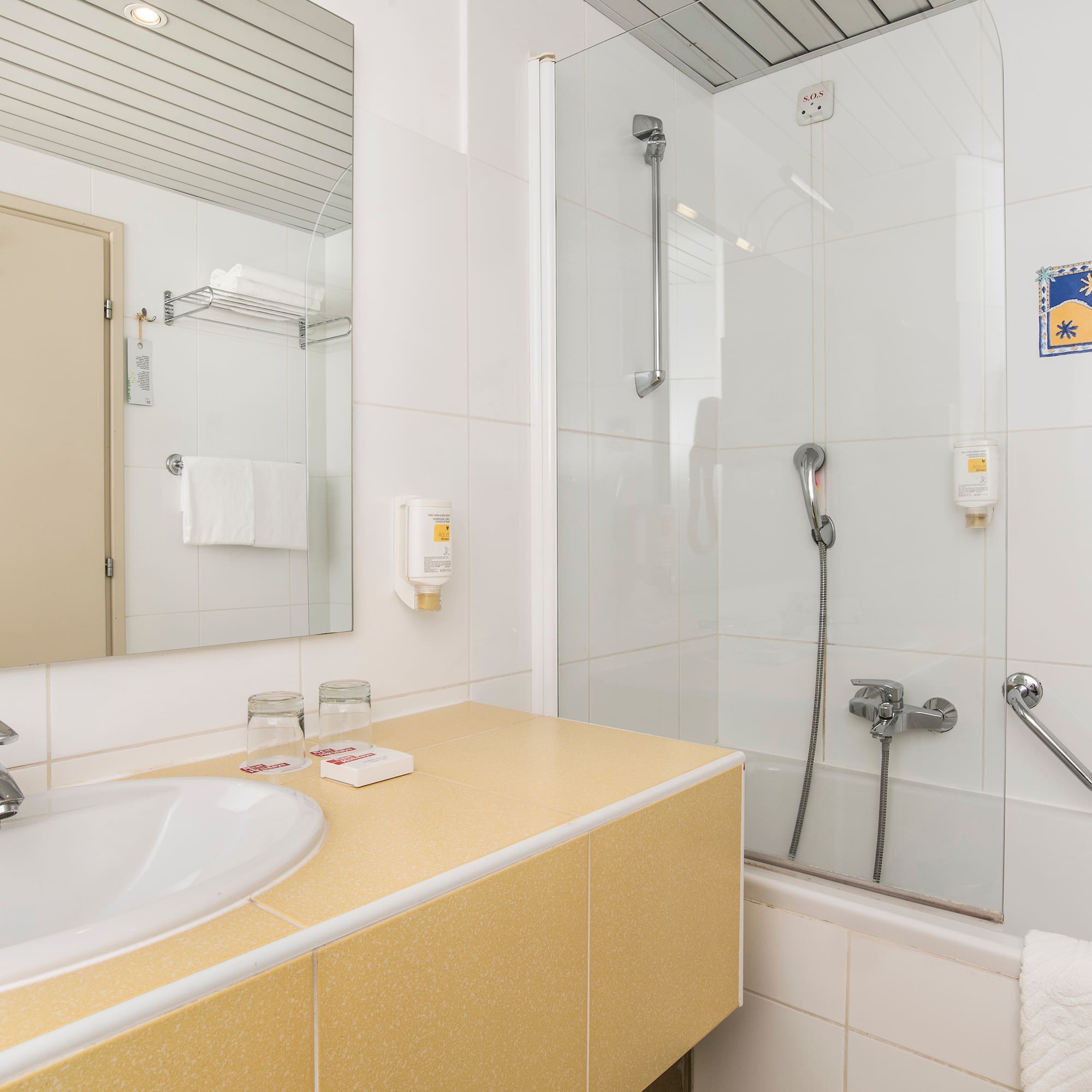 a bathroom with a shower and sink