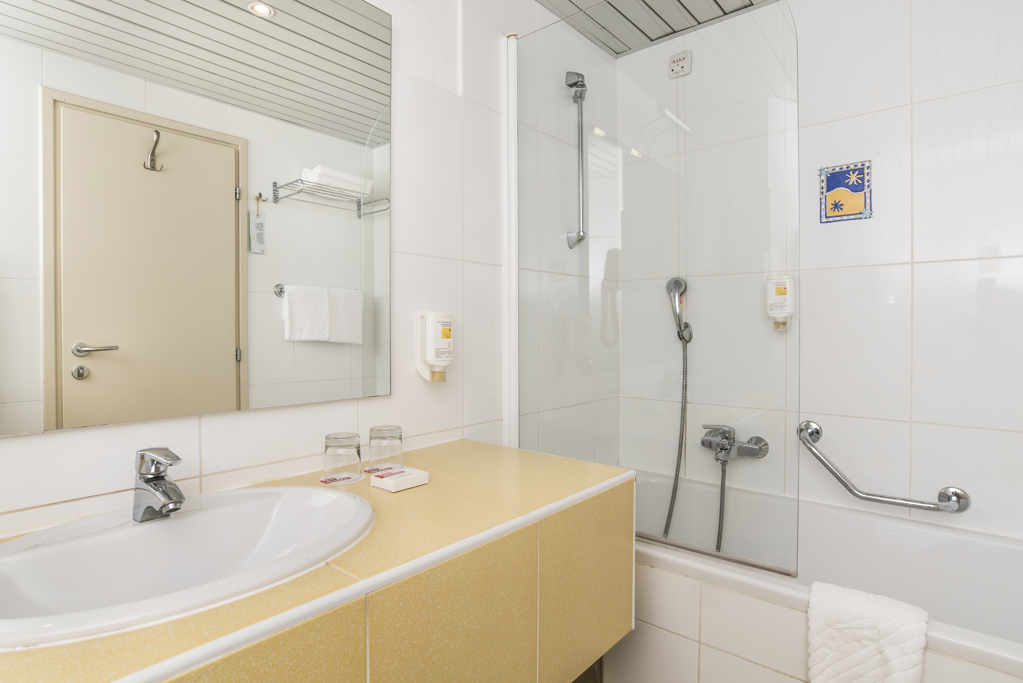 a bathroom with a shower and sink